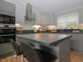 A kitchen with appliances and a countertop at 7 Lake View Windermere