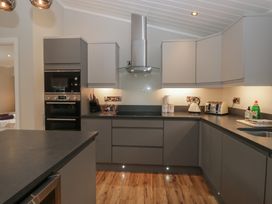 A kitchen with appliances and countertops at 7 Lake View in Windermere
