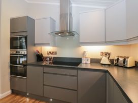 A kitchen with appliances and storage at 7 Lake View in Windermere
