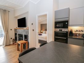 A kitchen with a table and chairs at 7 Lake View in Windermere