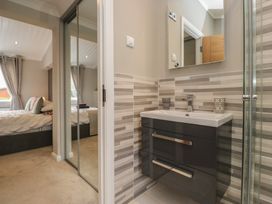 A bathroom with a sink and shower at 7 Lake View in Windermere
