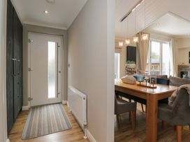 A dining area with a table and chairs at 7 Lake View in Windermere