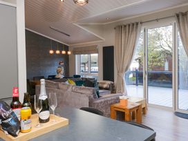 A living room with a sofa and a coffee table at 7 Lake View, Lake View 7, White Cross Bay near Windermere