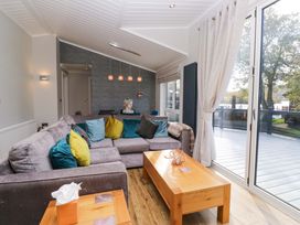 A living room with a sofa and coffee table at 7 Lake View, Lake View 7, White Cross Bay near Windermere