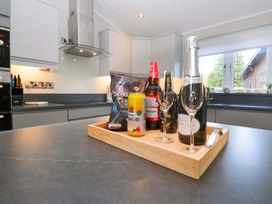A kitchen countertop with drinks and snacks at 7 Lake View, Lake View 7, White Cross Bay near Windermere