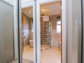 A bathroom featuring shower, toilet, and sink at 7 Lake View, Lake View 7, White Cross Bay near Windermere