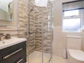 A bathroom with shower, toilet and sink at 7 Lake View, Lake View 7, White Cross Bay near Windermere