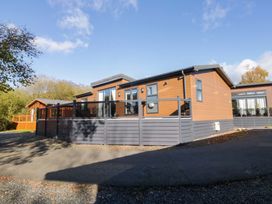 A wooden lodge with decking at 7 Lake View, Lake View 7, White Cross Bay near Windermere