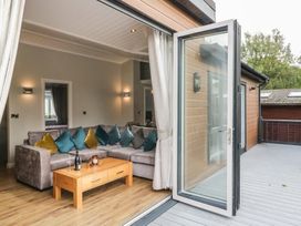 A living room with a sofa and table at 7 Lake View, Lake View 7, White Cross Bay near Windermere