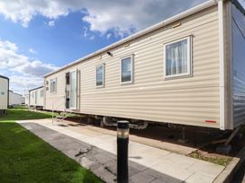 A static caravan with steps and a door in Rhyl