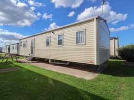 A static caravan with steps and picnic table at A5 Static Caravan Rhyl