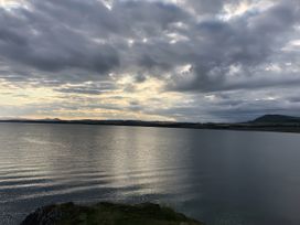 A view of water and clouds with hills in the background at 5 Rush Grove Caravan Leven