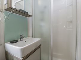 A bathroom with a sink and shower at Caravan - 2 Bayside Watchet