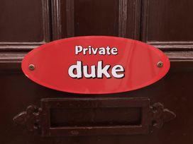 A door sign labeled 'Private duke' at Duke Cottage in Woodbridge