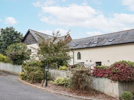 A house with garden and trees at Rushmoor Cottage in Colaton Raleigh