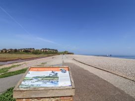 A sign and pathway at Otter Estuary Nature Reserve in Colaton Raleigh