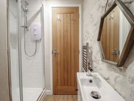 A bathroom with shower and sink at 1 Fron Uchaf in Parc near Bala
