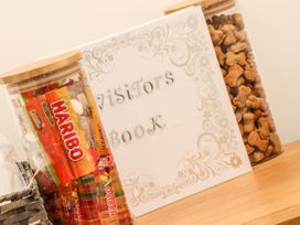 A visitor book and jars of candy and snacks at Thomas Chambers in Camborne