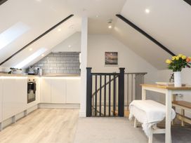 A kitchen area with a stove and sink at Thomas Chambers in Camborne