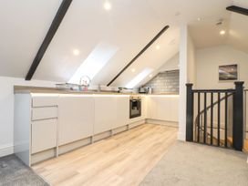 A kitchen with cabinets and an oven at Thomas Chambers in Camborne