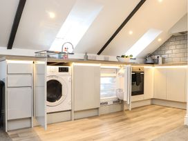 A kitchen with appliances and cabinets at Thomas Chambers in Camborne