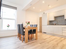 A dining room with a table and chairs at West Chambers in Camborne