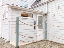 An entrance with a door and signboard at Teylu in Camborne