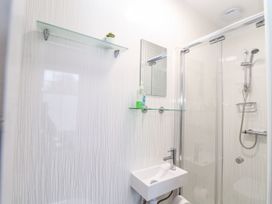 A bathroom with a shower and sink at Teylu in Camborne