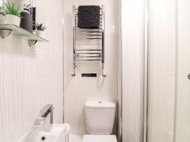 A bathroom with a sink and toilet at Teylu in Camborne