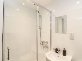 A bathroom with a shower and sink at Battell Chambers in Camborne