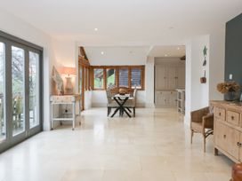 A dining room with a table and chairs at Spring View in Tetbury