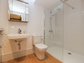 A bathroom with a sink, toilet, and shower at Spring View in Tetbury