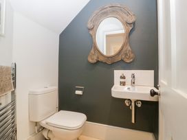 A bathroom with a toilet and sink at Spring View in Tetbury