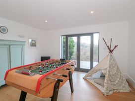 A snug with a foosball table and a tent at Spring View, Kingscote, Gloucestershire