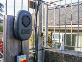 A charging station mounted on a fence at Gilfach Goed in Abersoch