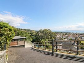 An outdoor area with a path and house at Awelfryn