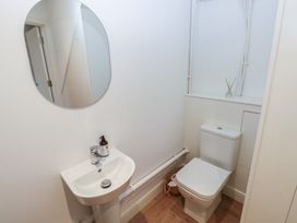 A bathroom with a sink and toilet at Awelfryn
