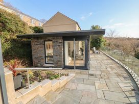 A house with a deck and garden space at Awelfryn in 