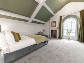 A bedroom with a bed and window at 8 Corkickle Whitehaven