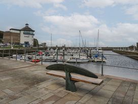 A marina with boats and a building at 8 Corkickle Whitehaven