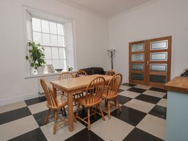 A dining room with a table and chairs at 8 Corkickle Whitehaven