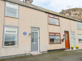 A house exterior with doors and windows at Riverside Cottage in Conwy