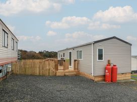 A house with a deck and gas canisters at Ellies House in Stranraer
