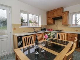 A kitchen with a table and chairs at Castle Terrace in Penrith