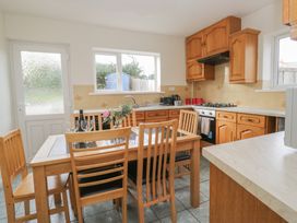 A kitchen with a table and chairs at Castle Terrace in Penrith