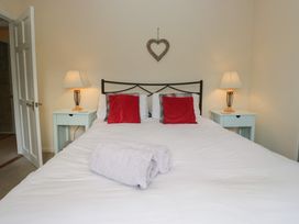 A bedroom with a bed and bedside tables at Castle Terrace in Penrith