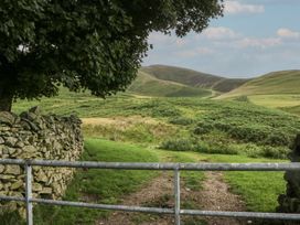 A landscape view with a gate and stone wall at Castle Terrace Penrith