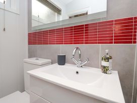 A bathroom with a sink and toilet at 5 Waterside Wood Troutbeck Bridge
