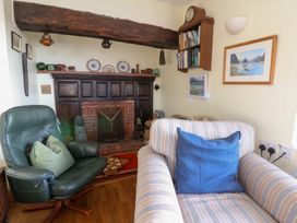 A living room with furniture and decorative items at Bryncyn in Newport, Pembrokeshire
