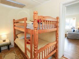 A bunk bed with pillows and blankets in a bedroom at Bryncyn in Newport, Pembrokeshire